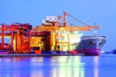 Container cargo freight ship at a loading dock